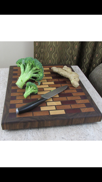 Large end grain cutting board made from solid hardwood maple, cherry, walnut, padauk, and purpleheart woods. great gift idea for the kitchen